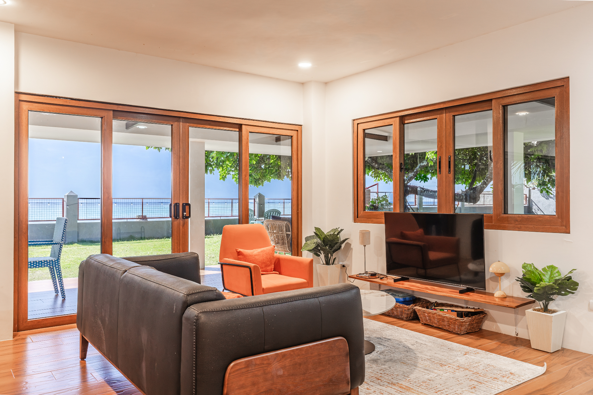 Living room opening to the beach with sea views