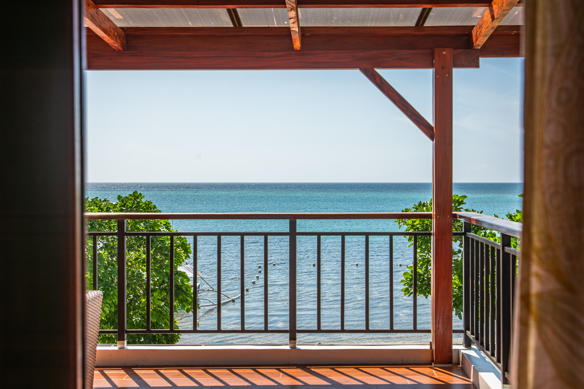 Sunlit veranda opening to the beach